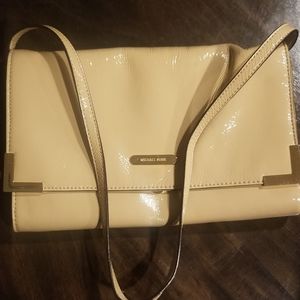 MK hand bag beige in color